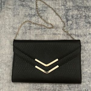 Black and Gold Aldo envelope bag with chain